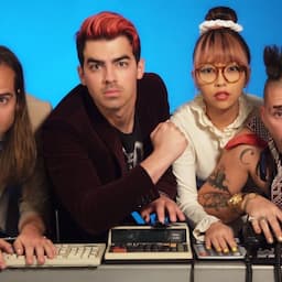 WATCH: Joe Jonas' DNCE Covers Rihanna's 'Work' With Retro Calculators, Dial-Up Internet and a Puppy