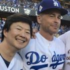 Ken Jeong, Rob Lowe and George Lopez at Dodger Stadium during Game 1 of the World Series
