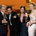 Game of Thrones cast members Kit Harrington, Emilia Clarke and Sophie Turner accept an award from Michael Douglas at the 2019 Emmys.
