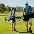 man and son playing golf