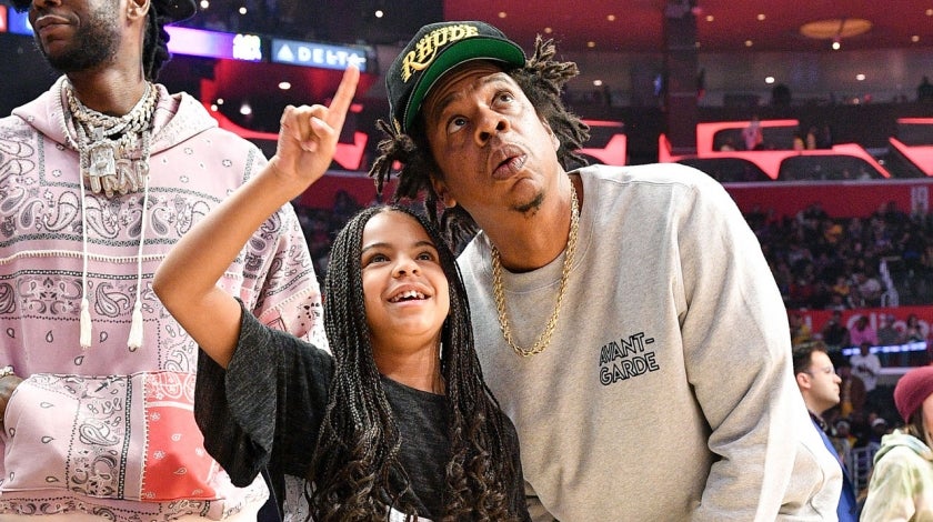 Jay-Z and Blue Ivy Carter attend a basketball game between the Los Angeles Clippers and the Los Angeles Lakers 