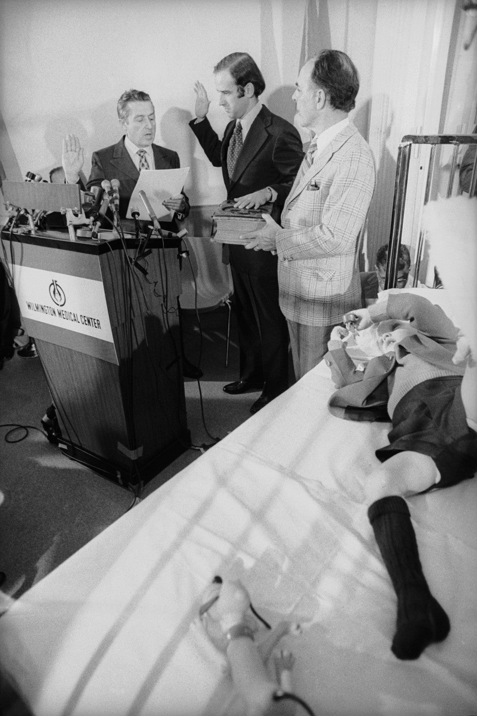 Joseph Biden takes the oath of office from the U.S. Senate's secretary, Frank Valeo with his father-in-law Robert Hunter and son Joseph Beau Biden at his side, in Beau's hospital room. 