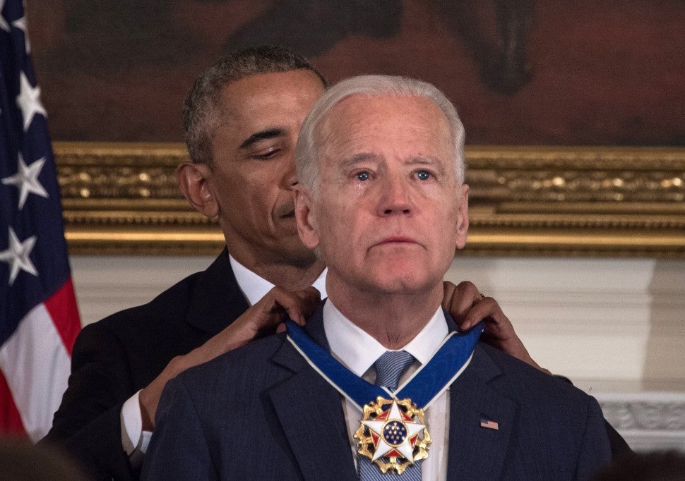 Barack Obama awards Vice President Joe Biden the Presidential Medal of Freedom during a tribute to Biden at the White House in Washington, DC, on January 12, 2017.
