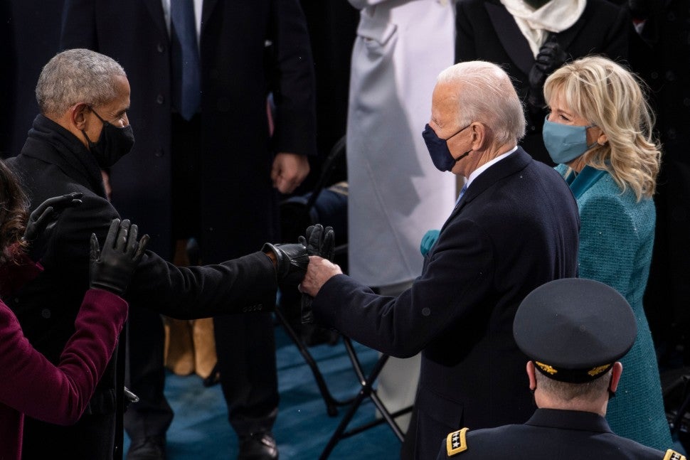 barack obama and joe biden fist bump at biden inauguration