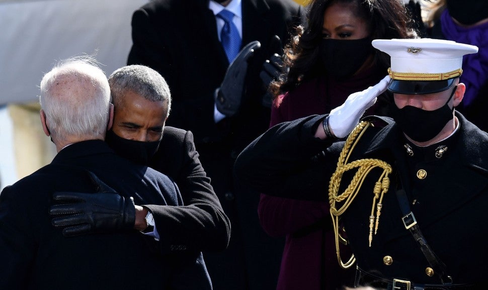 barack obama and joe biden embrace at biden inauguration