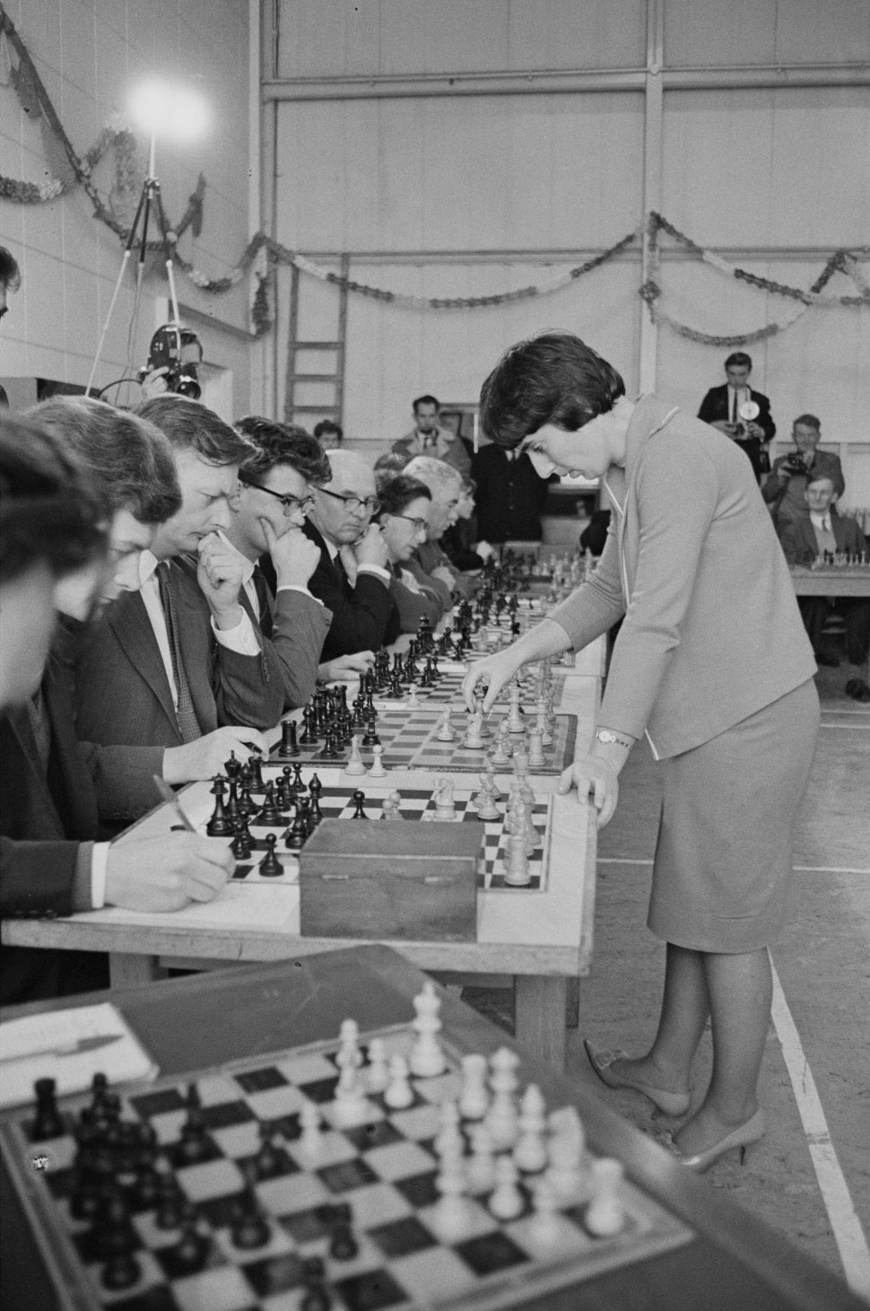 Georgian chess player Nona Gaprindashvili, women's world chess champion, playing against 28 men at once in Dorset, UK, 11th January 1965.