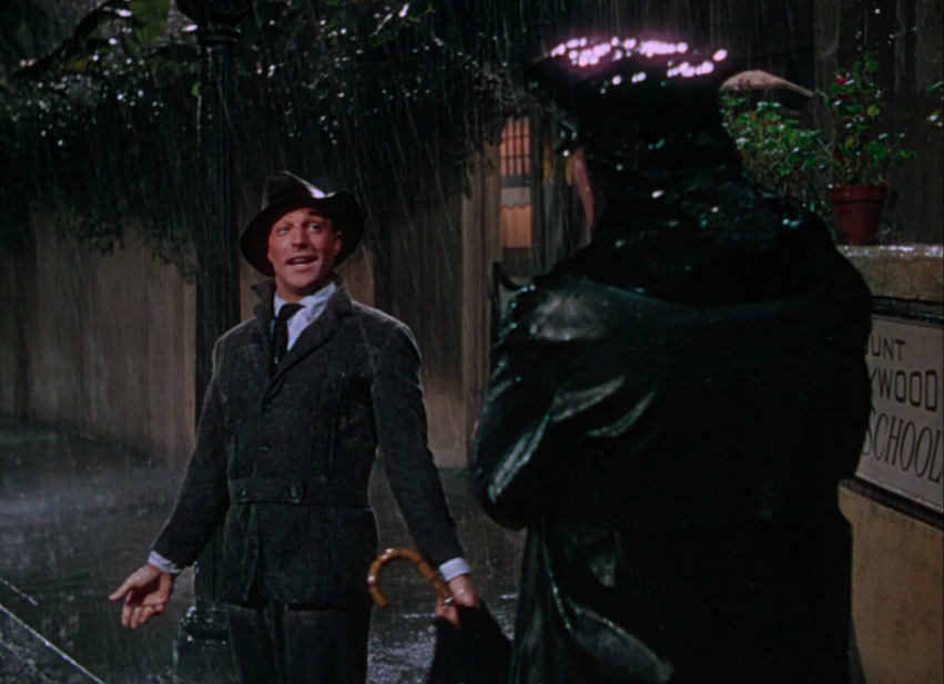 Gene Kelly encounters a police officer in 'Singin' in the Rain.'