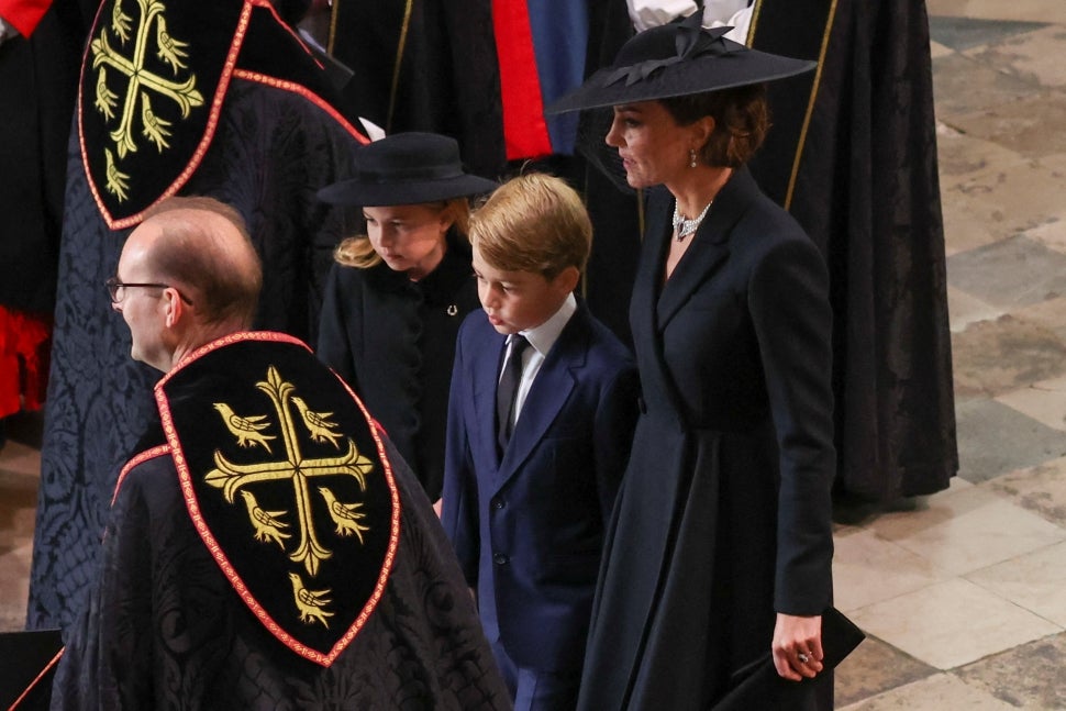 Britain's Catherine, Princess of Wales, Princess Charlotte and Prince George arrive for the State Funeral Service of Britain's Queen Elizabeth II at Westminster Abbey in London on September 19, 2022.