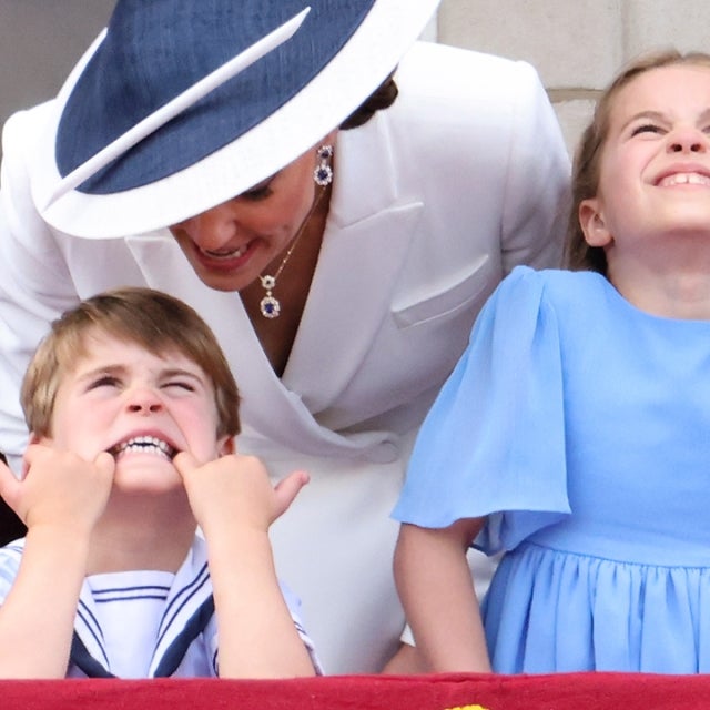 Britain's Catherine, Duchess of Cambridge, (2L) talks to Britain's Prince Louis of Cambridge (2L), as they stand with Britain's Princess Charlotte of Cambridge and Britain's Prince George of Cambridge to watch a special flypast from Buckingham Palace balcony following the Queen's Birthday Parade, the Trooping the Colour, as part of Queen Elizabeth II's platinum jubilee celebrations, in London on June 2, 2022. 