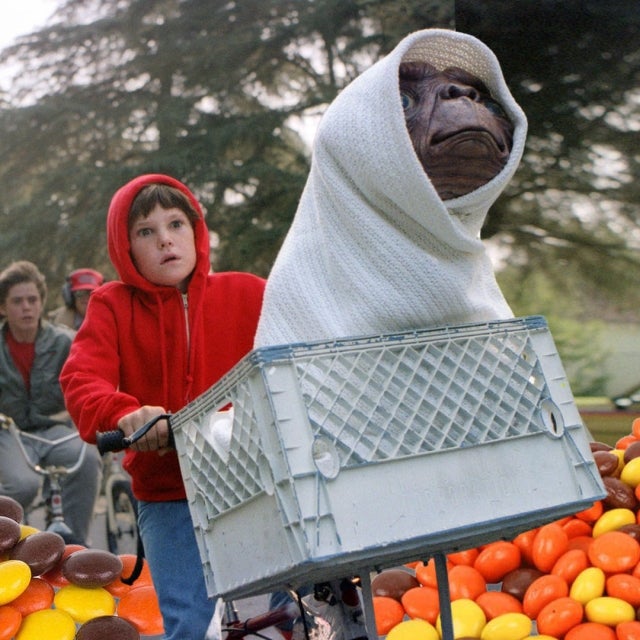 Elliott and E.T. prepare to escape law enforcement with an aerial flight in the movie's climatic moments.