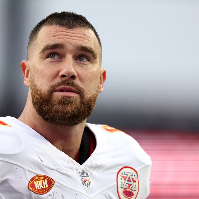 Travis Kelce #87 of the Kansas City Chiefs looks on without his helmet on the way to the locker room during halftime against the New England Patriots at Gillette Stadium on December 17, 2023 in Foxborough, Massachusetts.