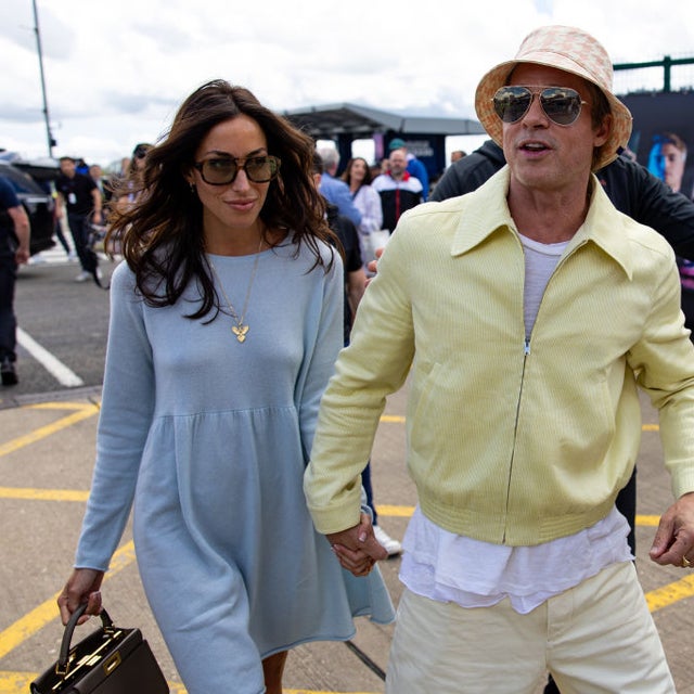 Actor Brad Pitt and girlfriend Ines De Ramon walk in the paddock during the F1 Grand Prix of Great Britain at Silverstone Circuit on July 7, 2024 in Northampton, United Kingdom