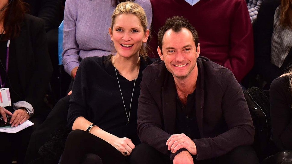 Phillipa Coan and Jude Law attend the Orlando Magic vs New York Knicks game at Madison Square Garden on February 26, 2016 in New York City. 